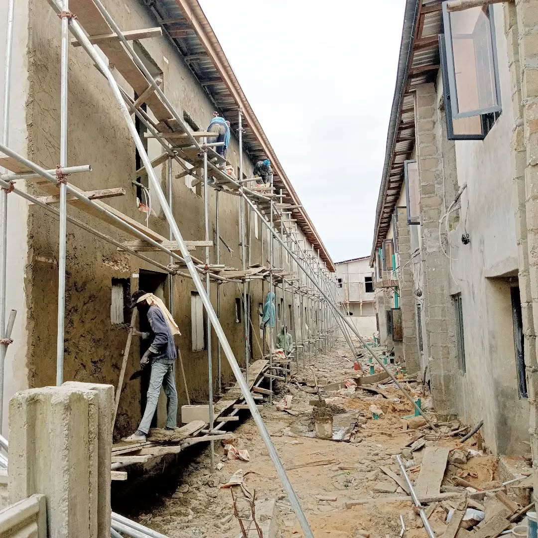 Housing estate construction with scaffolding and workers